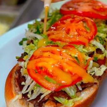 Jacques Cartier Pizza - Boulevard Rome - a sandwich with tomatoes and lettuce - Pizza Near Me - Brossard, Quebec Jacques Cartier Pizza - Boulevard Rome - a sandwich with tomatoes and lettuce - Pizza Near Me - Brossard, Quebec