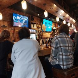 Johnnie's Bar - partial bar view, tvs above bar
