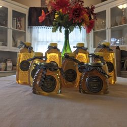 Haughville Honey - Skep jars in front, 1 pound squeeze bottles in second row, and the 3 pound sentinel bottles in the back row.