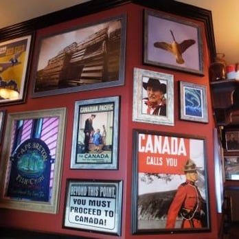 Hudsons Canada's Pub - a wall full of posters - Sports Bars Near Me - Saskatoon, Saskatchewan