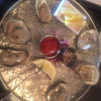 Steak & Main - Oysters on the half shell with cocktail sauce, mignonette, and extra lemon - Steakhouses Near Me - North East, Maryland Steak & Main - Oysters on the half shell with cocktail sauce, mignonette, and extra lemon - Steakhouses Near Me - North East, Maryland
