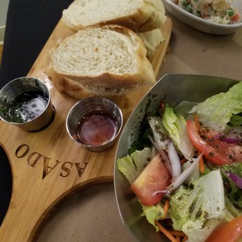 Asado Argentinian Grill - Nice bread with a spectacular chimichurri sauce and some form of red infused oil. - Argentine Near Me - Orem, Utah Asado Argentinian Grill - Nice bread with a spectacular chimichurri sauce and some form of red infused oil. - Argentine Near Me - Orem, Utah