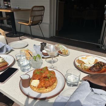 Palm Tree Club - Our spread accompanied by a nice cool breeze coming from the inside. - Wine Bars Near Me - Kansas City, Missouri Palm Tree Club - Our spread accompanied by a nice cool breeze coming from the inside. - Wine Bars Near Me - Kansas City, Missouri