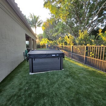 Ideal Environmental Solutions - New hot tub hookup with artificial turf clean back yard with a beautiful working fence from te dogs - Landscaping Near Me - West Palm Beach, Florida Ideal Environmental Solutions - New hot tub hookup with artificial turf clean back yard with a beautiful working fence from te dogs - Landscaping Near Me - West Palm Beach, Florida