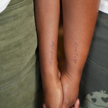 Iconic Lines Studio - Couple tattoos, song lyrics "it won't stop". - Tattoo Near Me - San Diego, California