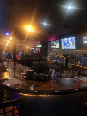 Photo of Los Cocos Bar And Restaurant - Port St. Lucie, FL, US. people sitting at the bar