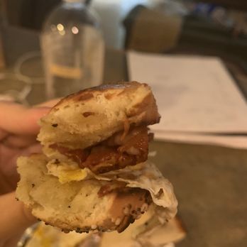 Corner Bagelry - Belmar - a hand holding a sandwich - Bagels Near Me - Belmar, New Jersey