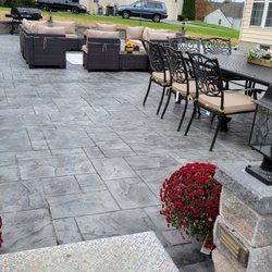 Pocono Exteriors - Stamped concrete patio and retaining wall
