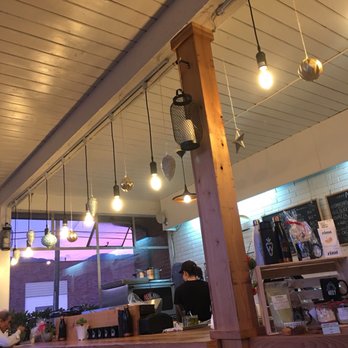 Workshop Vegetarian Cafe - Bar and order counter with baked goods to the right - Vegetarian Near Me - North Vancouver, British Columbia Workshop Vegetarian Cafe - Bar and order counter with baked goods to the right - Vegetarian Near Me - North Vancouver, British Columbia