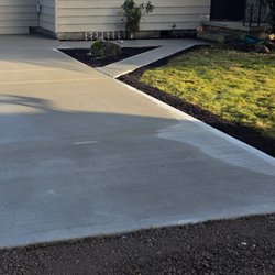 Pacific Chimney & Masonry - New driveway with a little bit of rain on it