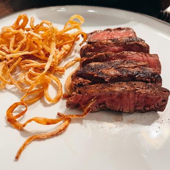 C Prime - a plate of steak, onions, and carrots - Italian Near Me - Vancouver, British Columbia