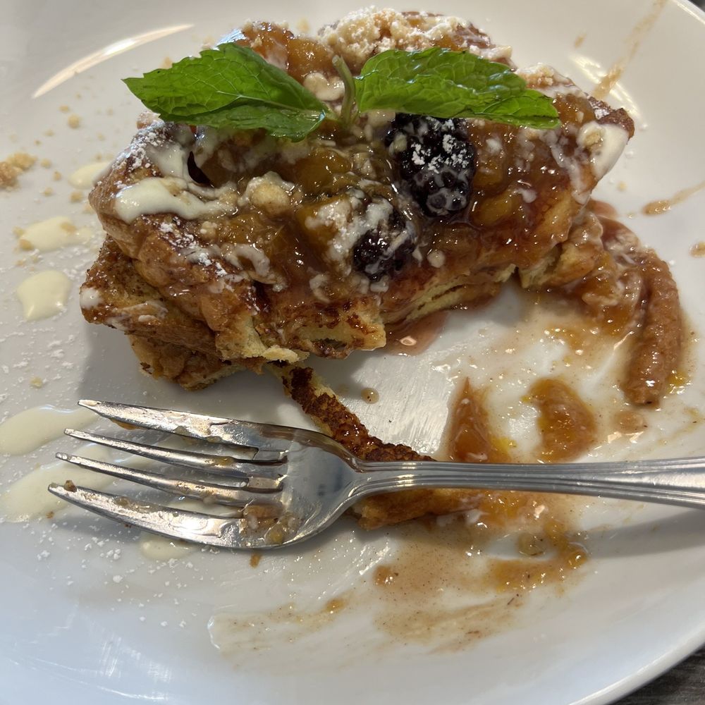 The Brunch House - Blueberry peach cobbler, French toast, with a couple of bites, missing! - Breakfast & Brunch Near Me - Temecula, California The Brunch House - Blueberry peach cobbler, French toast, with a couple of bites, missing! - Breakfast & Brunch Near Me - Temecula, California