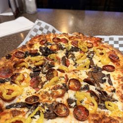 The Distillery Restaurant Victor - The charred pepperoni pizza with mushrooms and banana peppers!