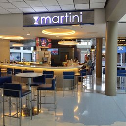 the interior of a restaurant with blue chairs