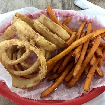 Stomp's Burger Joint 2 - Basket of think cut rings and sweet potato fries - Burgers Near Me - Pearland, Texas Stomp's Burger Joint 2 - Basket of think cut rings and sweet potato fries - Burgers Near Me - Pearland, Texas