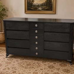 Nixon's Oak Tree House - Nine-drawer dresser refinished in black, carved corners kept intact.