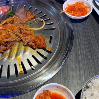 Gen Korean BBQ House - a large grill with a lot of food on it - Barbeque Near Me - Dallas, Texas Gen Korean BBQ House - a large grill with a lot of food on it - Barbeque Near Me - Dallas, Texas