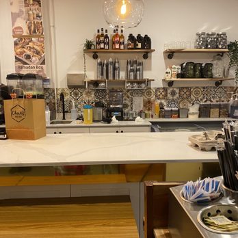Chachee's Chai Cafe - a kitchen with a counter and shelves - Indian Near Me - Scarborough, Ontario Chachee's Chai Cafe - a kitchen with a counter and shelves - Indian Near Me - Scarborough, Ontario