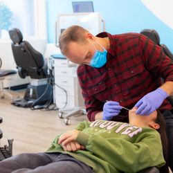 Beckstrom Orthodontics - Dr. Beckstrom working on a patient.