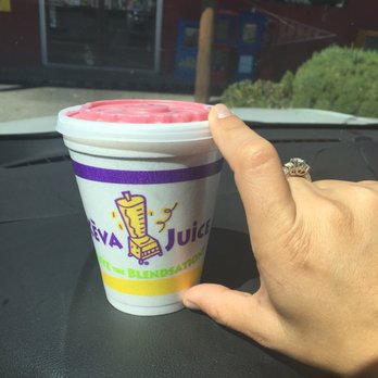 Keva Juice - a hand holding a cup of keva juice - Juice Bars & Smoothies Near Me - Albuquerque, New Mexico