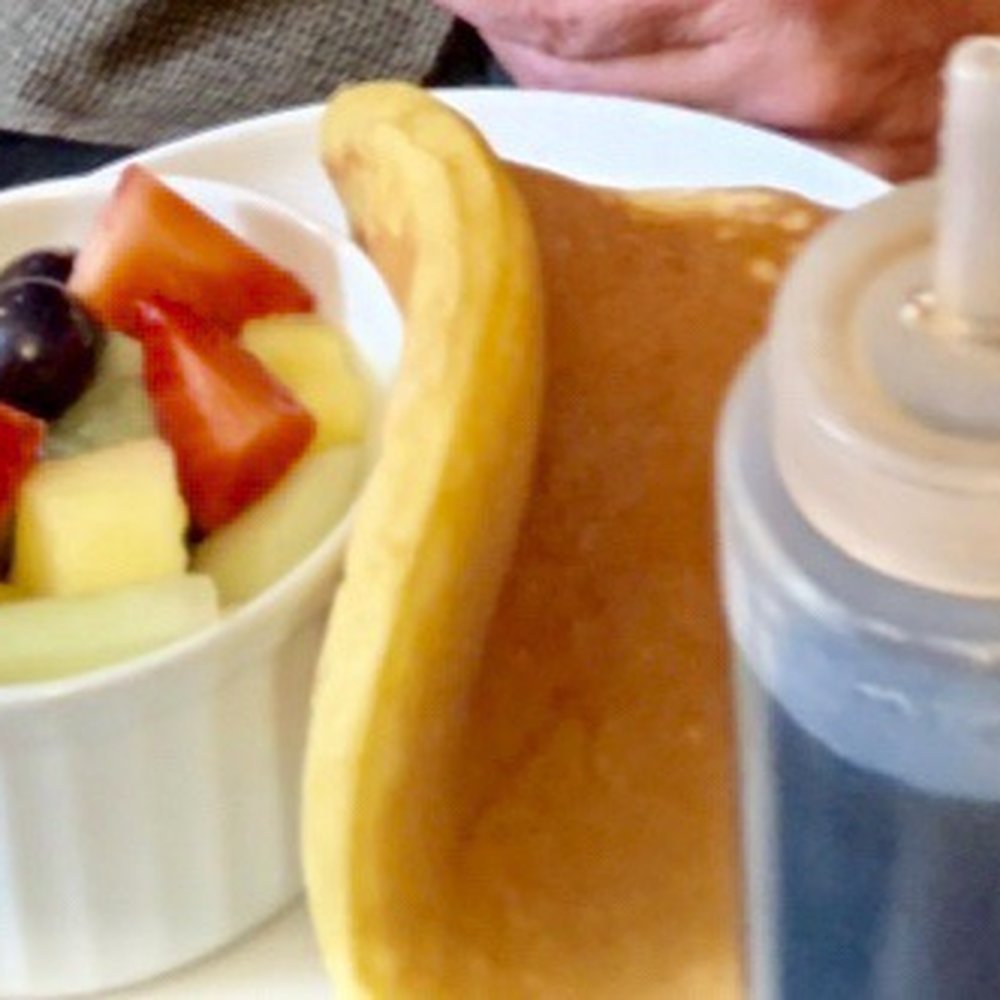 The only pic I had my the pancakes and fruit. Cutting off my dad's hand The only pic I had my the pancakes and fruit. Cutting off my dad's hand