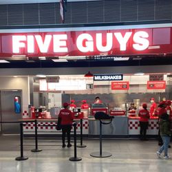 Five Guys - Photograph of the entrance to the Five Guys restaurant at Concourse B in Dulles International Airport in Dulles, Virginia.