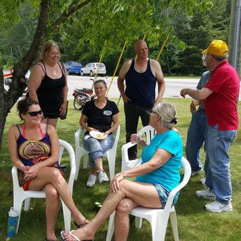 Cross Village General Store - a group of people sitting under a tree - Grocery Near Me - Cross Village, Michigan Cross Village General Store - a group of people sitting under a tree - Grocery Near Me - Cross Village, Michigan