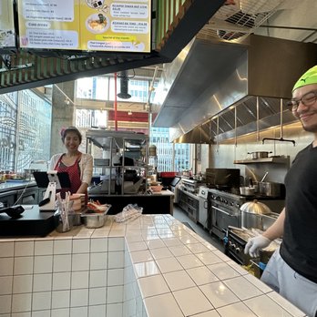E-Jae Pak Mor - Open style kitchen with owners in pic - Thai Near Me - Seattle, Washington
