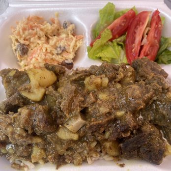 Ekaete Pink Corner - Goat curry with coleslaw and small salad. Really great flavors and spices. - Caribbean Near Me - Coral Bay, Virgin Islands