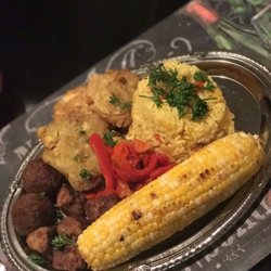 Wisdom Bakery & Cafe - Vegan pork, our famous vegan patella with a side of corn and sweet peppers