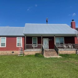 Southern Hospitality Roofing & Remodeling - Halfway through installation of a new metal roof