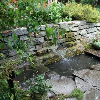 Artisans Landscape - mortared sierra granite ledge stone wall, water spilling over into pond - Landscaping Near Me - San Francisco, California