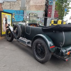 Smash Palace - Cool old car parked outside on the sidewalk