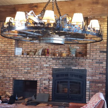 Dobson Creek Coffee Co - a large chandelier hanging over a fireplace - Coffee & Tea Near Me - Ronan, Montana Dobson Creek Coffee Co - a large chandelier hanging over a fireplace - Coffee & Tea Near Me - Ronan, Montana