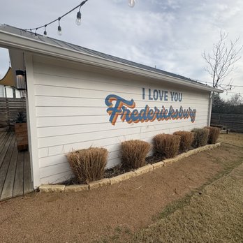 Ferris & Fletch Wine - Backyard wall art - Wine Bars Near Me - Fredericksburg, Texas