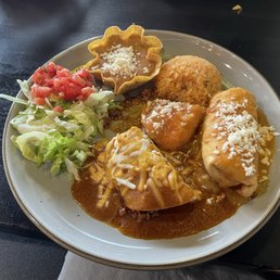 Combo 2 with Enchilada and Chimichanga (and part of hubby's Chile Relleño in the middle) Combo 2 with Enchilada and Chimichanga (and part of hubby's Chile Relleño in the middle)