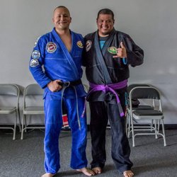 Roland Malone Academy of Jiu-Jitsu - Richard earns his purple belt. Also pictured, Professor Malone.