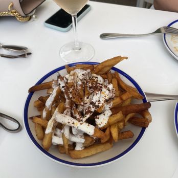 Mandolin Aegean Bistro - House Cut Fries with Garlic Greek Yogurt - Mediterranean Near Me - Miami, Florida Mandolin Aegean Bistro - House Cut Fries with Garlic Greek Yogurt - Mediterranean Near Me - Miami, Florida