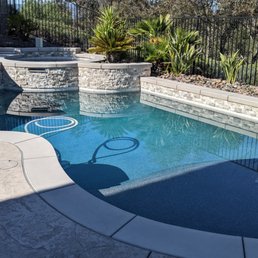 MacBet demo'd our old and replaced with new concrete coping, ledger stone, tile, pebble, and stamped concrete. MacBet demo'd our old and replaced with new concrete coping, ledger stone, tile, pebble, and stamped concrete.