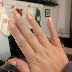 Cosmo Nails - NYE dip manicure with painted gold sparkle tips