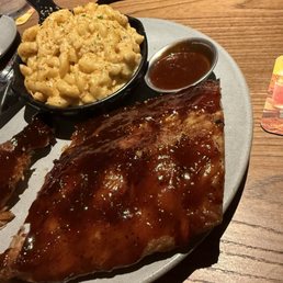 Half rack of ribs with premium upgraded side of steakhouse mac and cheese. Half rack of ribs with premium upgraded side of steakhouse mac and cheese.