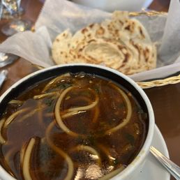 Chicken soup and paratha bread Chicken soup and paratha bread