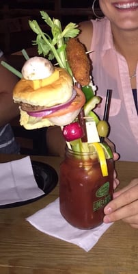 Photo of The Rockin' Horse Saloon & Grill - Oak Forest, IL, US. The "Rockin' Bloody", complete with hamburger slider, fried chicken wing, cheese, beef stick, and veggies. DELICIOUS.