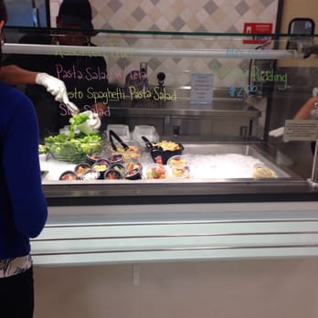 Currents Riverview Bistro - a woman serving food - New American Near Me - Jacksonville, Florida