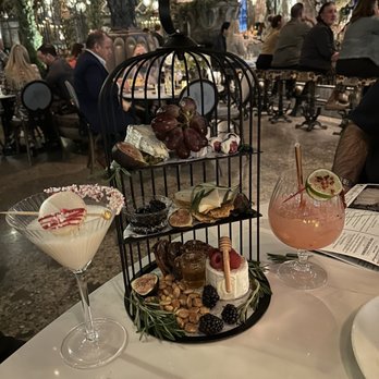 Vanderpump A Paris - Birdcage aux fromage - super pretty charcuterie Sleigh All Day white chocolate martini on left - seasonal Dec 2022 - French Near Me - Las Vegas, Nevada