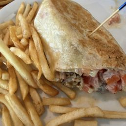 Half of grilled chicken wrap w/fries