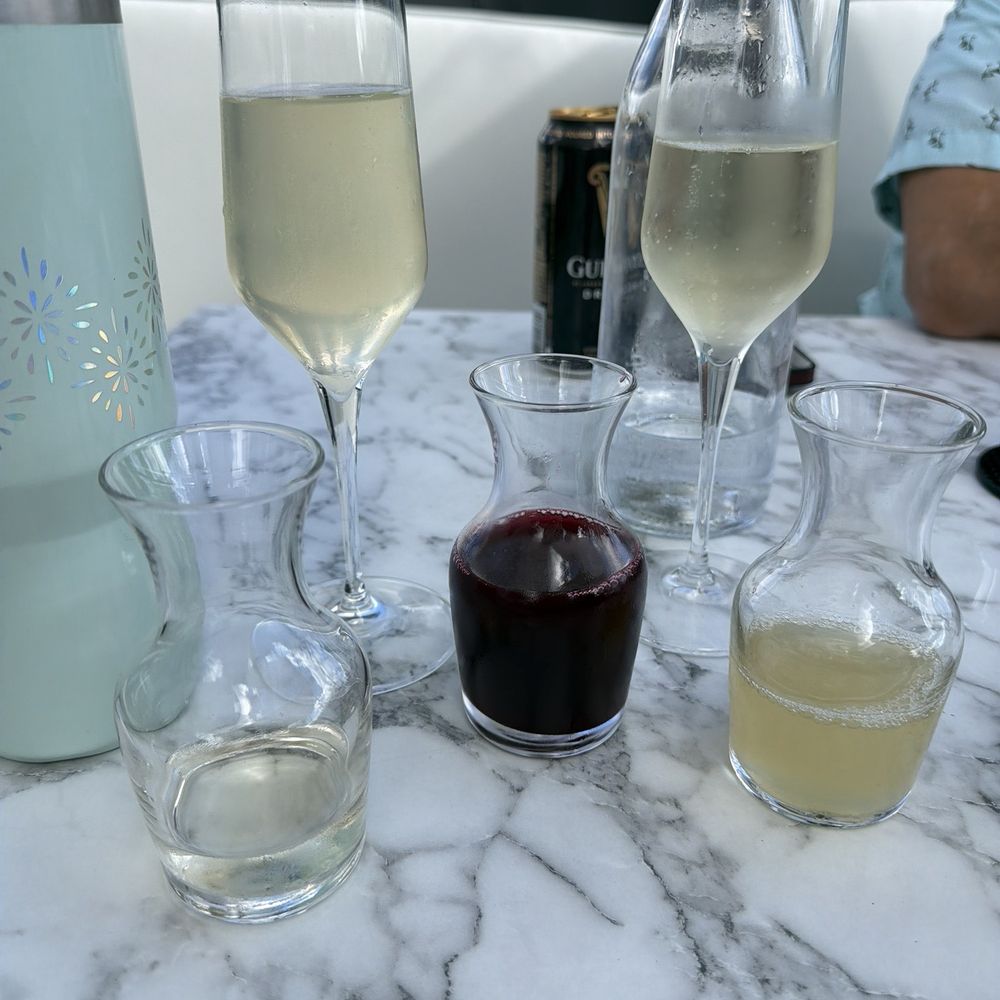 Boca - Mimosa with pomegranate juice and pineapple juice - New American Near Me - Lake Mary, Florida Boca - Mimosa with pomegranate juice and pineapple juice - New American Near Me - Lake Mary, Florida