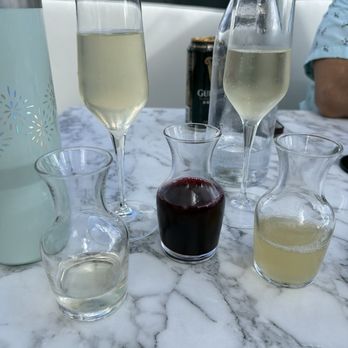 Boca - Mimosa with pomegranate juice and pineapple juice - New American Near Me - Lake Mary, Florida Boca - Mimosa with pomegranate juice and pineapple juice - New American Near Me - Lake Mary, Florida