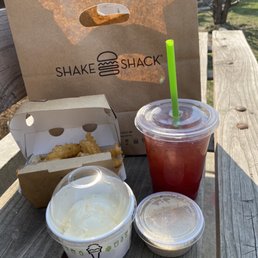 Truffle fries and sauce, orange 50/50 drink, vanilla custard.