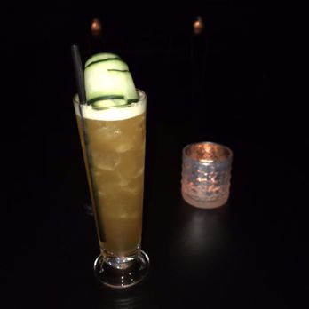 Howard & Fine - a cucumber cocktail with a cucumber garnish - Speakeasies Near Me - Omaha, Nebraska